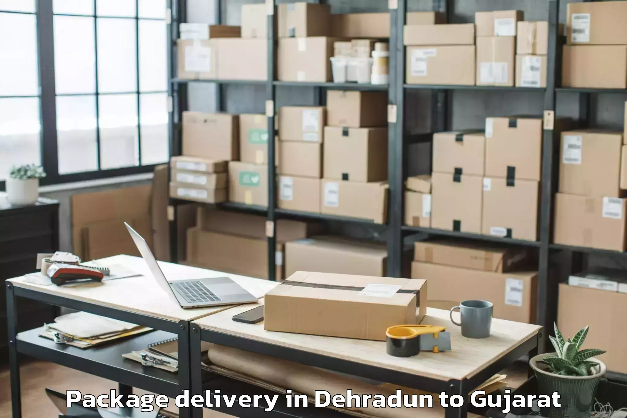 Trusted Dehradun to Kalavad Package Delivery